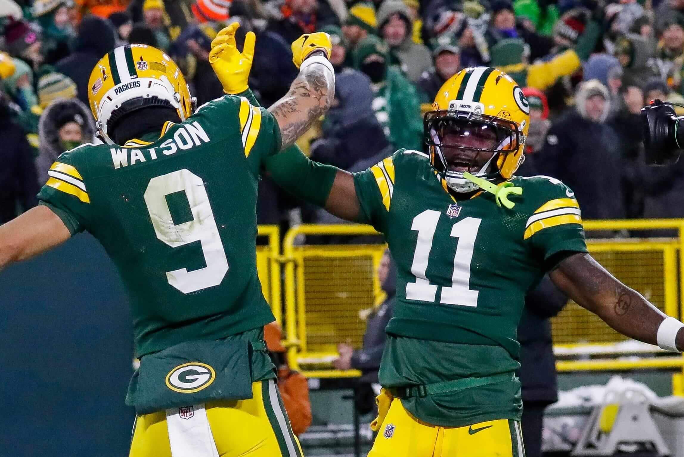 Green Bay Packers wide receiver Christian Watson (9) and wide receiver Jayden Reed celebrate after Watson scores a touchdown against the Chicago Bears on Sunday, December 7, 2025, at Lambeau Field in Green Bay.