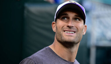 Minnesota Vikings quarterback Kirk Cousins (8) walks to the field before an NFL football game a ...