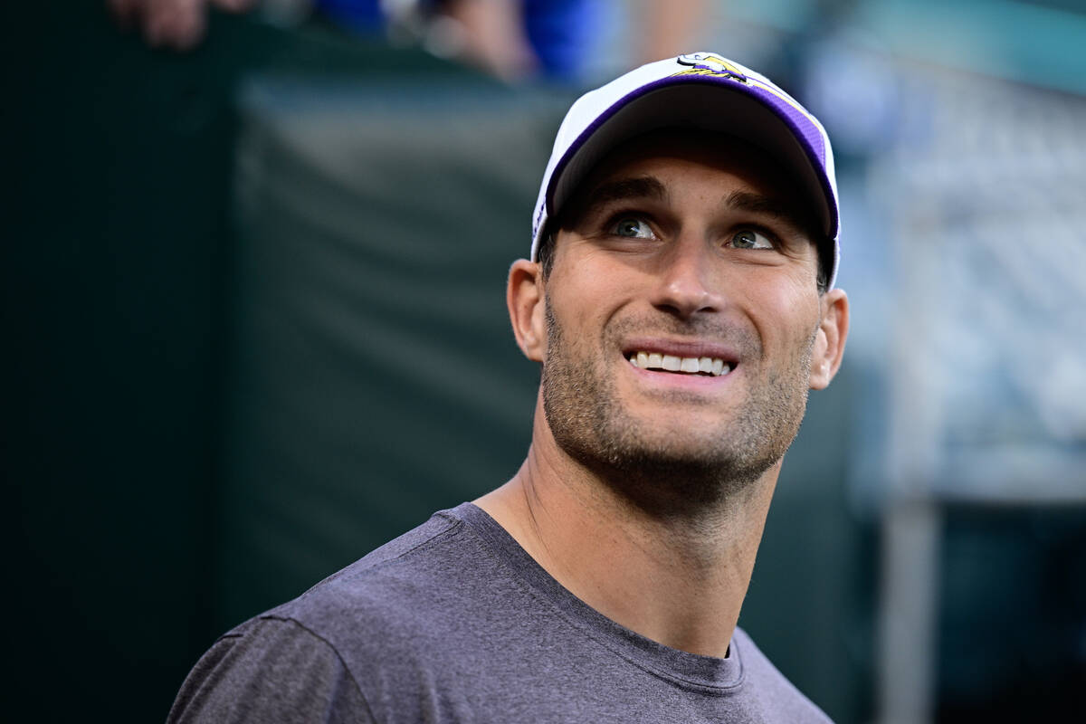 Minnesota Vikings quarterback Kirk Cousins (8) walks to the field before an NFL football game a ...