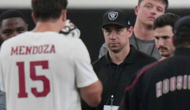 Las Vegas Raiders head coach Klint Kubiak, center, watches Indiana quarterback Fernando Mendoza ...