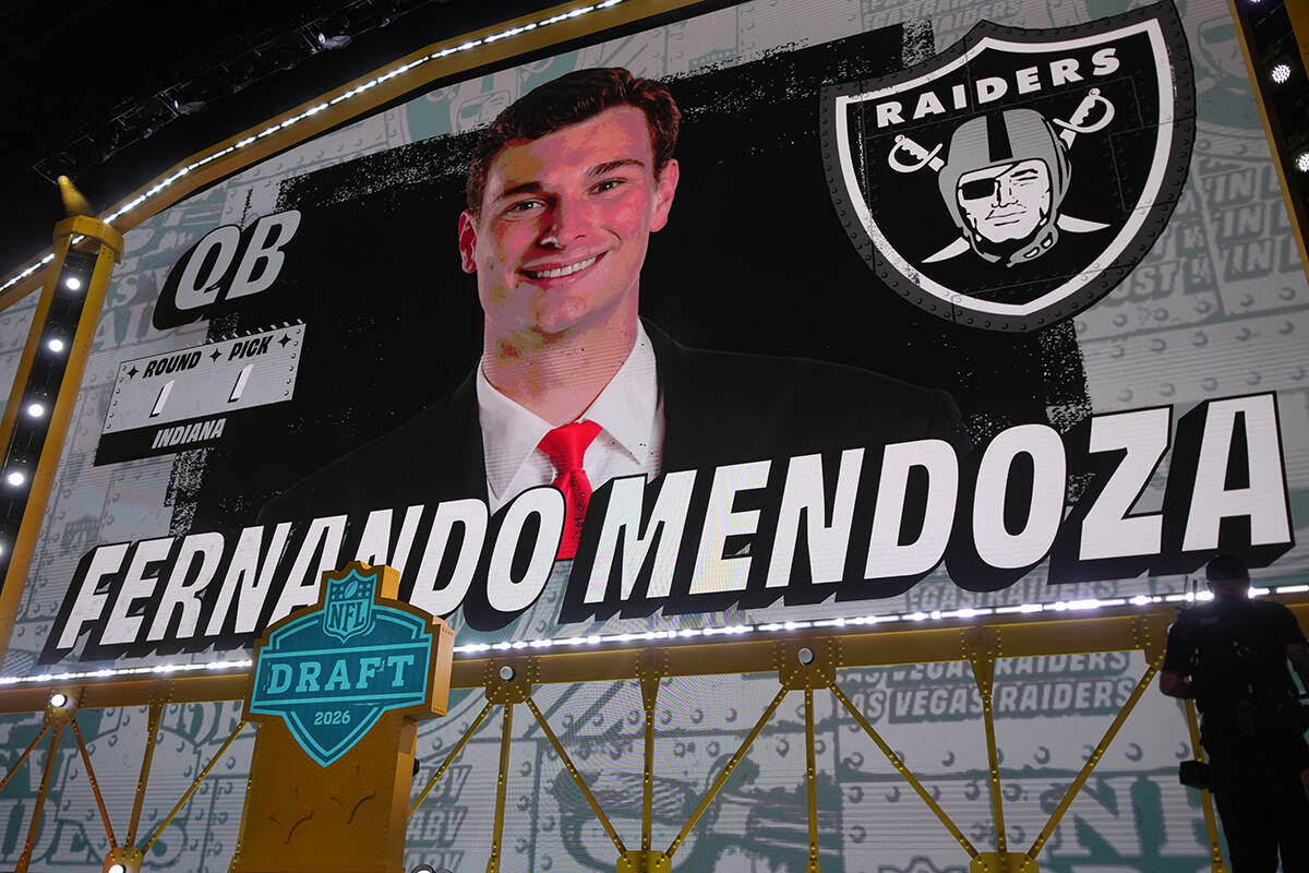 Indiana quarterback Fernando Mendoza is shown on a screen after being chosen by the Las Vegas R ...