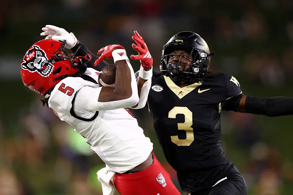 Wake Forest cornerback Karon Prunty defends North Carolina State's Noah Rogers.