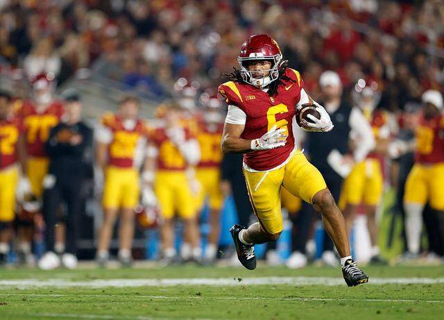 Southern Cal’s Makai Lemon runs a reverse during a 29-10 USC win over the UCLA Bruins on Nov. 29, 2025, at Los Angeles Memorial Coliseum.