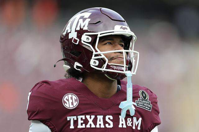 KC Concepcion of the Texas A&M Aggies warms up prior to a 2025 College Football Playoff first-round game against the Miami Hurricanes at Kyle Field in College Station, Texas.