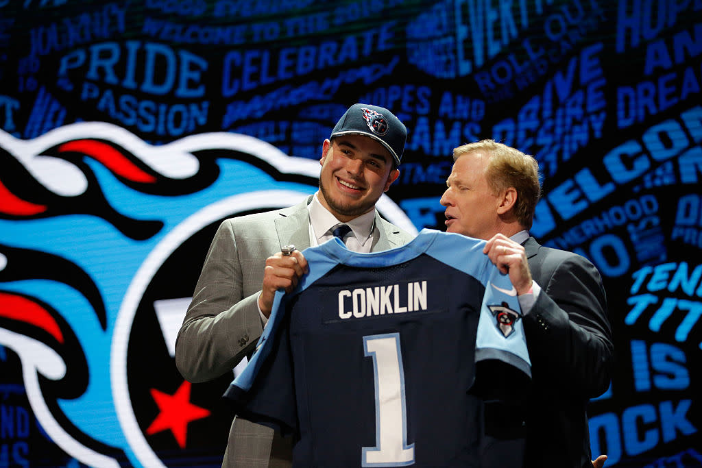 Jack Conklin of Michigan State holds up a jersey with NFL Commissioner Roger Goodell after being picked #8 overall by the Tennessee Titans during the first round of the 2016 NFL Draft at the Auditorium Theatre of Roosevelt University on April 28, 2016 in Chicago, Illinois. (Photo by Jon Durr/Getty Images)