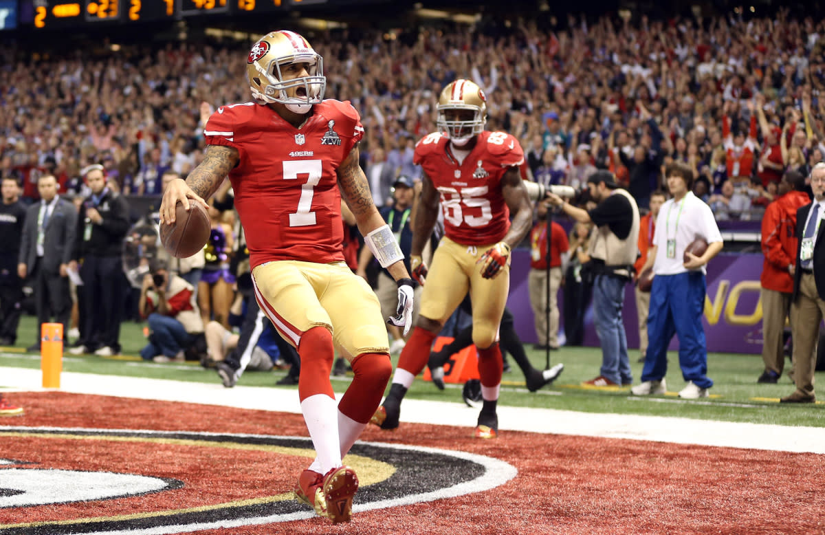 San Francisco 49ers quarterback Colin Kaepernick scores a touchdown against the Baltimore Ravens in the fourth quarter of Super Bowl XLVII at the Superdome.© Mark J&period; Rebilas-USA TODAY Sports