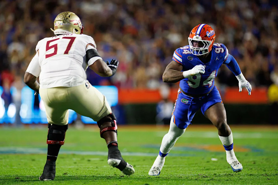 Nov 29, 2025; Gainesville, Florida, USA; Florida Gators defensive lineman Tyreak Sapp (94) rushes to tackle while Florida State Seminoles offensive lineman Micah Pettus (57) blocks during the first half at Ben Hill Griffin Stadium. Mandatory Credit: Matt Pendleton-Imagn Images