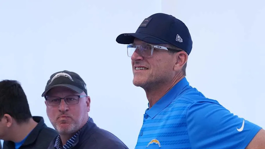 Los Angeles Chargers coach Jim Harbaugh and general manager Joe Hortiz.