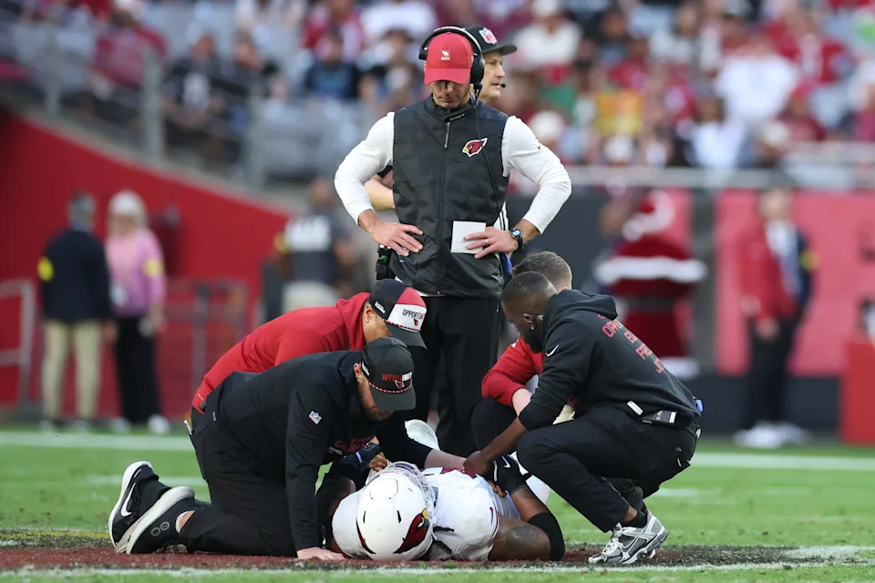 Head coach Jonathan Gannon looks on as Walter Nolen III (97) of the Arizona Cardinals is attended to during the second half against the Atlanta Falcons at State Farm Stadium on Dec. 21, 2025, in Glendale.