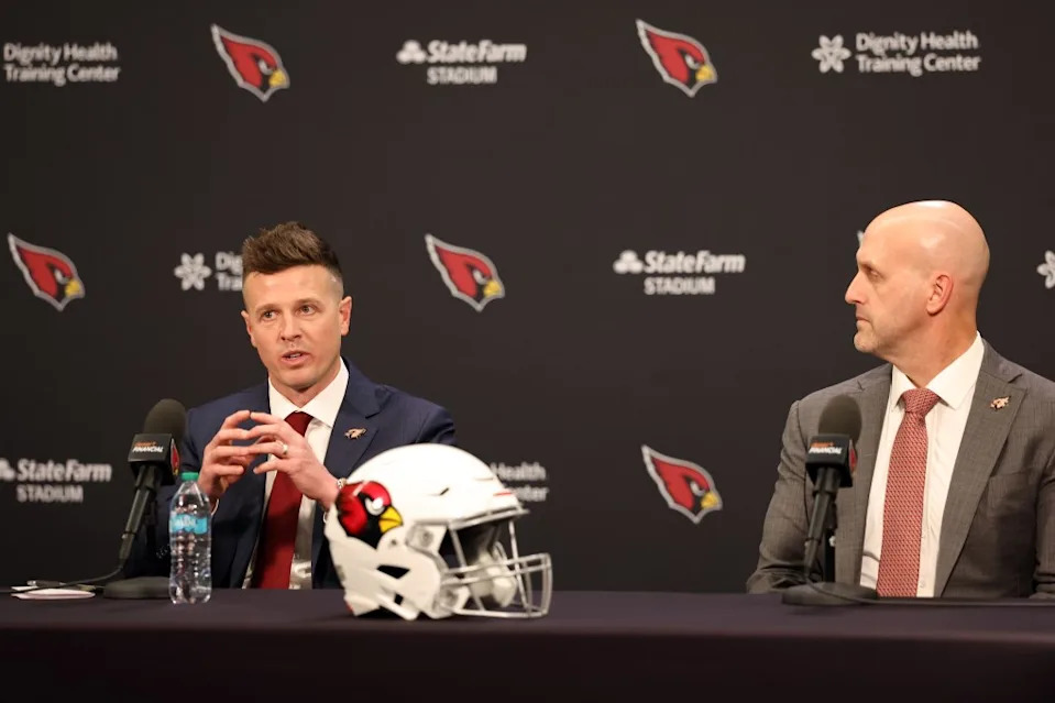 New <a class="link " href="https://sports.yahoo.com/nfl/teams/arizona/" data-i13n="sec:content-canvas;subsec:anchor_text;elm:context_link" data-ylk="slk:Arizona Cardinals;sec:content-canvas;subsec:anchor_text;elm:context_link;itc:0" data-yga="{"yLinkElement":"context_link","yModuleName":"content-canvas","yLinkText":"Arizona Cardinals","ySubModuleName":"anchor_text","yHasCommerce":false}">Arizona Cardinals</a> head coach Mike LaFleur (L) speaks as general manager Monti Ossenfort looks o during a press conference at Dignity Health Arizona Cardinals Training Center on February 03, 2026 in Tempe, Arizona. Getty Images