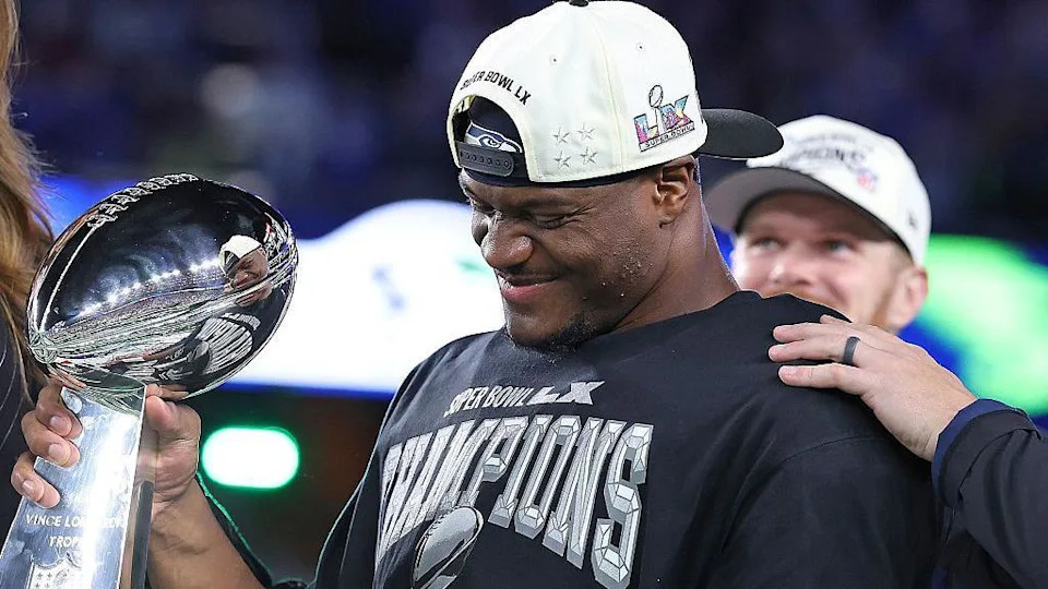 Kenneth Walker holding the Super Bowl trophy after winning with the Philadelphia Eagles