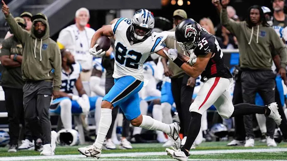 Carolina Panthers tight end Tommy Tremble (82) runs with the ball in the overtime 
