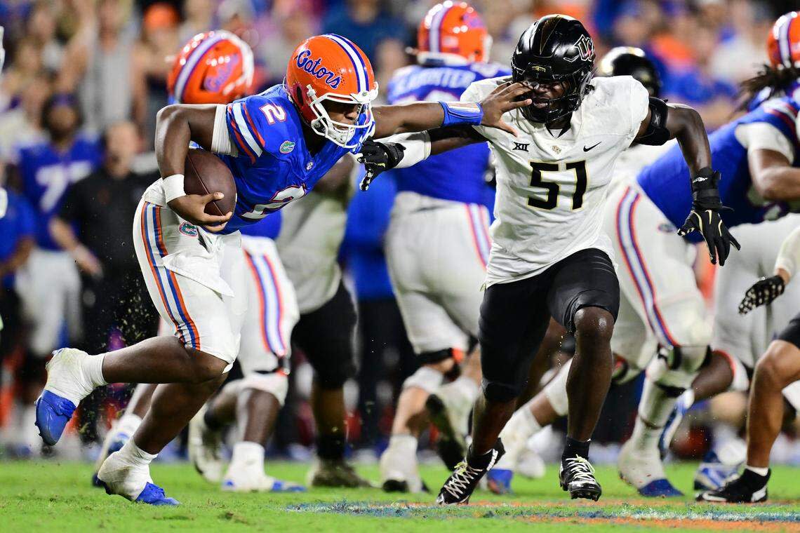 DJ Lagway #2 of the Florida Gators runs at Malachi Lawrence #51 of the UCF Knights in the fourth quarter of an NCAA college football game at Ben Hill Griffin Stadium on October 5, 2024, in Gainesville, Florida. (Photo by Julio Aguilar/Getty Images)