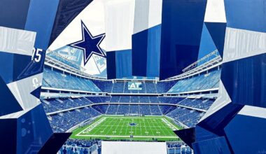 A fragmented, cubist-style painting depicting the Dallas Cowboys football team and AT&T Stadium in a palette of navy blue, silver, and white, with the elements broken down into sharp, overlapping geometric shapes and planes.