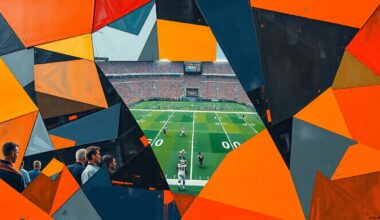 A fragmented, geometric painting in shades of orange, blue, and grey, depicting an abstract football or draft scene broken down into sharp, overlapping planes, conveying the complexity of the player evaluation process.