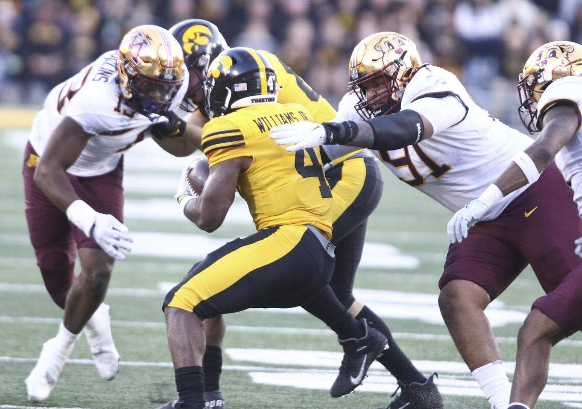 Defensive lineman Deven Eastern #91 of the Minnesota Golden Gophers makes a tackle during the second half on running back Leshon Williams #4 of the Iowa Hawkeyes at Kinnick Stadium on October 21, 2023, in Iowa City, Iowa. (Photo by Matthew Holst/Getty Images)