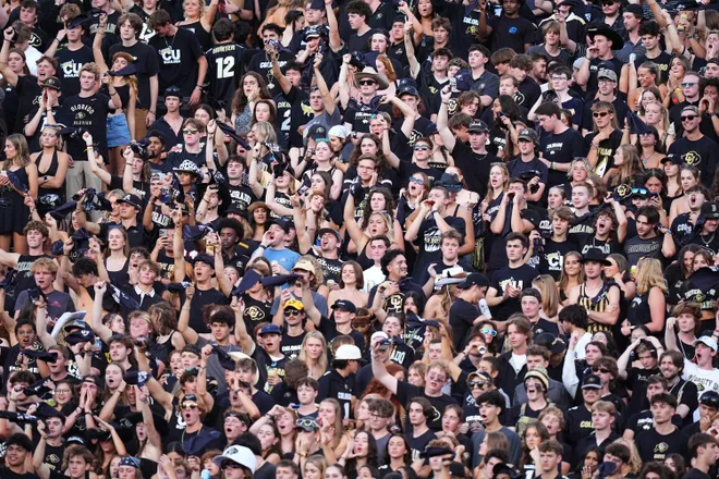 Aug 29, 2024; Boulder, Colorado, USA; Colorado Buffaloes fan cheer in the first half against the North Dakota State Bison at Folsom Field. Mandatory Credit: Ron Chenoy-USA TODAY Sports