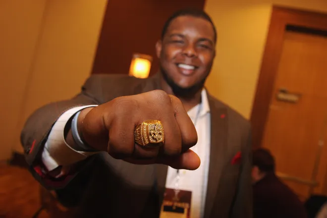 INDIANAPOLIS, IN - FEBRUARY 01: Jermon Bushrod of the New Orleans Saints accepting the 2011 FedEx Air NFL Player of the year award on behalf of New Orleans quarterback Drew Brees during during the FedEx Air and Ground NFL Players of the Year awards during a news conference prior to Super Bowl XLVI. In honor of the winners' great seasons, FedEx will donate $25,000 to each of their local New Orleans and Philadelphia Junior Achievement chapters to support the next generation of entrepreneurs in their communities. at JW Marriott on February 1, 2012 in Indianapolis, Indiana. (Photo by Rick Diamond/Getty Images for FedEx,)