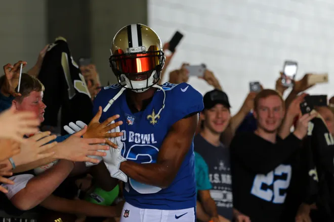 Jan 28, 2018; Orlando, FL, USA; New Orleans Saints wide receiver Michael Thomas (13) high fives fans as he takes the field prior to the game against the AFC in the 2018 NFL Pro Bowl at Camping World Stadium. Mandatory Credit: Aaron Doster-USA TODAY Sports