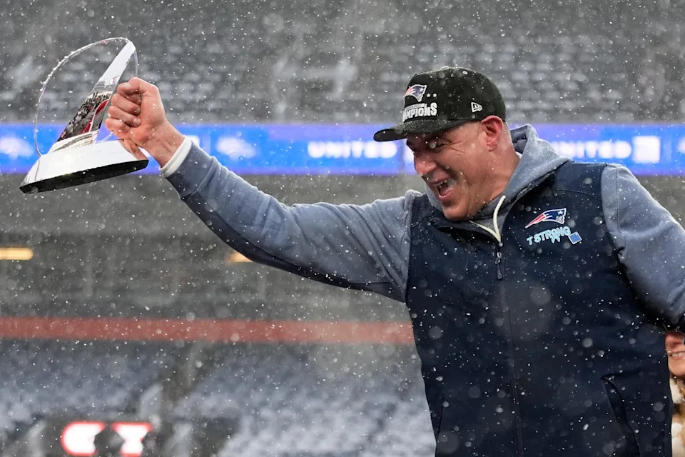 New England Patriots head coach Mike Vrabel celebrates with the trophy after the AFC Championship NFL football game between the Denver Broncos and the New England Patriots, Sunday, Jan. 25, 2026, in Denver. (AP Photo/John Locher)
