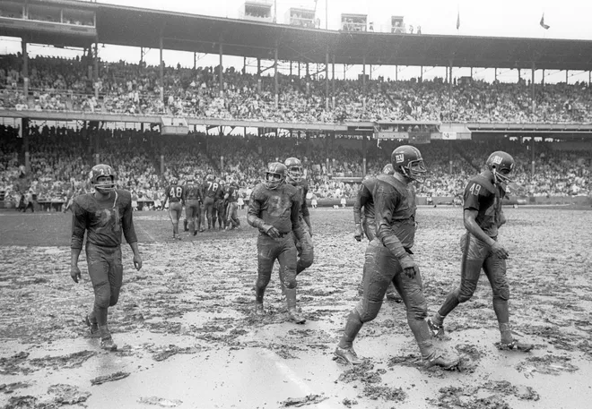 Nov 15, 1964; St. Louis, MO, USA; FILE PHOTO; New York Giants defensive end Andy Robustelli (81), Erich Barnes (49), Allan Webb (21), Jerry Hillebrand (87), and John Contoulis (77) walk off the field during the mud bowl of 1964 against the St. Louis Cardinals at Busch Stadium. Mandatory Credit: Herb Weitman-USA TODAY Sports