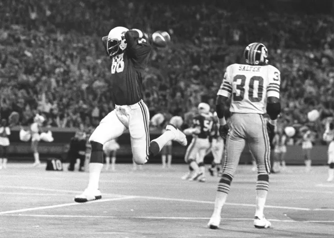 Nov 16, 1975; St. Louis, MO, USA: FILE PHOTO; St. Louis Cardinals receiver J.V. Cain (88) reacts after scoring a touchdown against Washington Redskins safety Bryant Salter (30) at Busch Stadium. St. Louis defeated Washington in overtime 20-17. Mandatory Credit: Herb Weitman-USA TODAY NETWORK