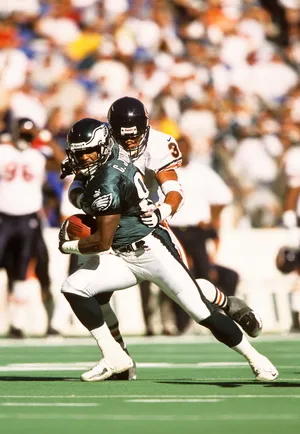 Oct 22, 2000; Philadelphia, PA, USA; FILE PHOTO; Philadelphia Eagles wide receiver Charles Johnson (81) attempts to avoid a tackle by Chicago Bears safety Mike Brown (30) at Veterans Stadium. Mandatory Credit: Lou Capozzola-USA TODAY NETWORK