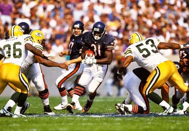 Oct 6, 1996; Chicago, IL, USA; FILE PHOTO; Chicago Bears running back Rashaan Salaam (31) carries the ball against Green Bay Packers defenders LeRoy Butler (36) and George Koonce (53) at Soldier Field. Mandatory Credit: Peter Brouillet-USA TODAY NETWORK
