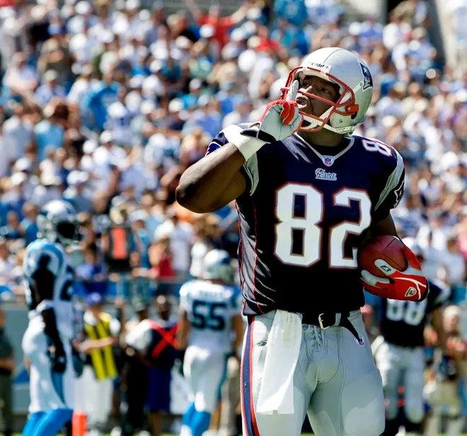 September 18, 2005; Charlotte, NC, USA; New England Patriots #82 Daniel Graham gestures to the crowd after scoring a touchdown in the Patriots 27-17 loss to the Carolina Panthers at Bank of America Stadium. Mandatory Credit: Bob Donnan-USA TODAY Sports Copyright © 2005 Bob Donnan