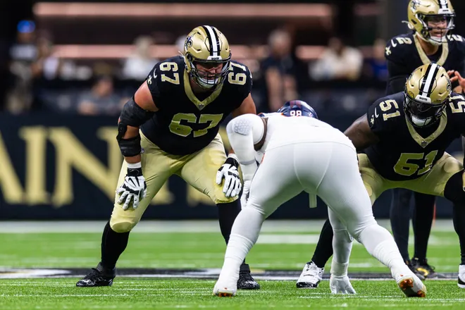 Aug 23, 2025; New Orleans, Louisiana, USA; New Orleans Saints offensive tackle Landon Young (67) blocks Denver Broncos defensive end John Franklin-Myers (98) during the first half at Caesars Superdome. Mandatory Credit: Stephen Lew-Imagn Images