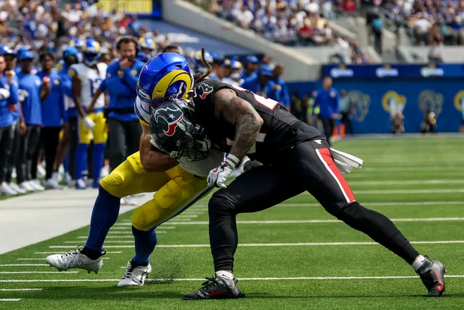 Sep 7, 2025; Inglewood, California, USA; Houston Texans cornerback Derek Stingley Jr. (24) attempts to tackle Los Angeles Rams wide receiver Jordan Whittington (88) during the third quarter at SoFi Stadium. Mandatory Credit: Kiyoshi Mio-Imagn Images