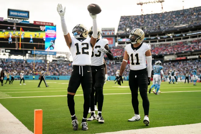 New Orleans Saints wide receiver Chris Olave (12) celebrates his touchdown against the Tennessee Titans during the third quarter at Nissan Stadium in Nashville, Tenn., Sunday, Dec. 28, 2025.