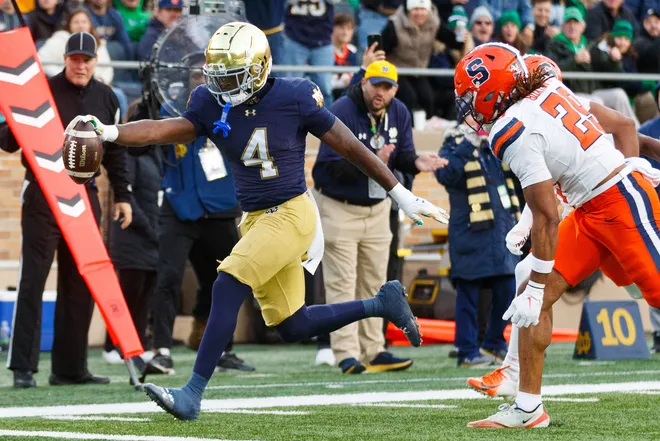 Notre Dame running back Jeremiyah Love (4) runs the ball into the end zone for a touchdown in the first half of a NCAA football game against Syracuse at Notre Dame Stadium on Saturday, Nov. 22, 2025, in South Bend.