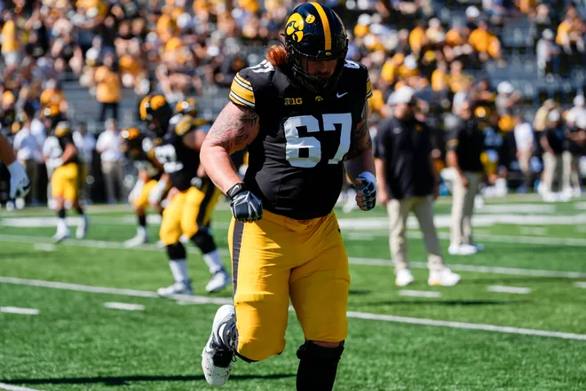 Iowa Hawkeyes offensive lineman Gennings Dunker (67) warms up before a football game against the Indiana Hoosiers Sept. 27, 2025 at Kinnick Stadium in Iowa City, Iowa.