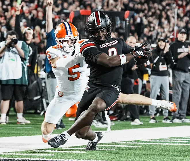 Louisville Cardinals wide receiver Chris Bell (0) got close to the end zone but officials ruled against his touchdown after a replay review as the Cards take on Clemson in the first half at L&N Stadium Friday, Nov. 14, 2025.