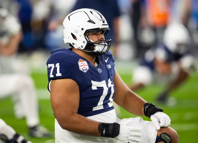 Dec 31, 2024; Glendale, AZ, USA; Penn State Nittany Lions offensive lineman Olaivavega Ioane (71) against the Boise State Broncos during the Fiesta Bowl at State Farm Stadium. Mandatory Credit: Mark J. Rebilas-Imagn Images