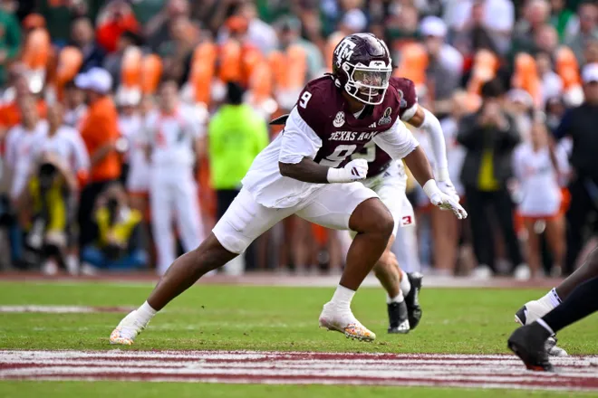 Dec 20, 2025; College Station, TX, USA; Texas A&M Aggies defensive end Cashius Howell (9) rushes the line during the game between the Aggies and the Hurricanes at Kyle Field. Mandatory Credit: Jerome Miron-Imagn Images