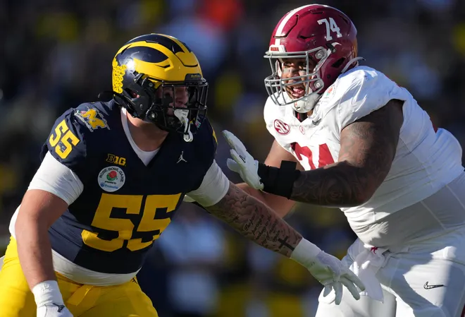 Alabama offensive lineman Kadyn Proctor blocks Michigan defensive lineman Mason Graham during the first half of the 2024 Rose Bowl game in the College Football Playoff national semifinal Jan. 1, 2024, in Pasadena, California.
