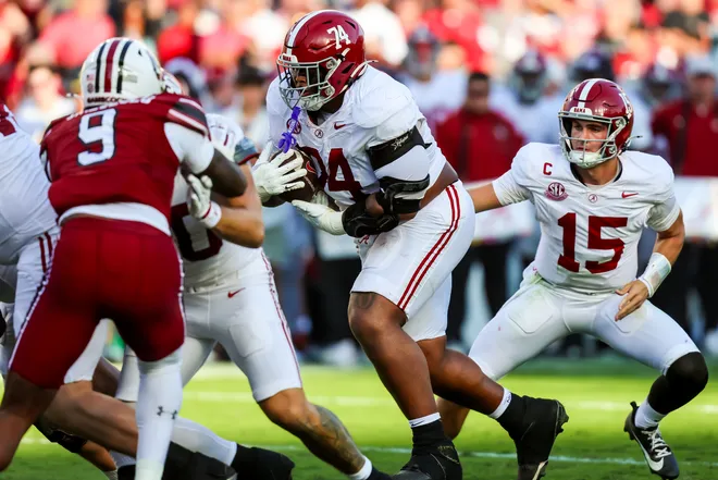 Oct 25, 2025; Columbia, South Carolina, USA; Alabama Crimson Tide offensive lineman Kadyn Proctor (74) rushes the ball against the South Carolina Gamecocks in the second quarter at Williams-Brice Stadium. Mandatory Credit: Jeff Blake-Imagn Images