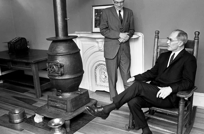 U.S. Supreme Court Justice Byron R. White sits by the antique pot-bellied stove on Feb. 8, 1966, in Vanderbilt University law school’s “old court room,†a replica of the typical Tennessee courtroom in the early 1800s.†He is talking with John Wade, dean of Vanderbilt law school.