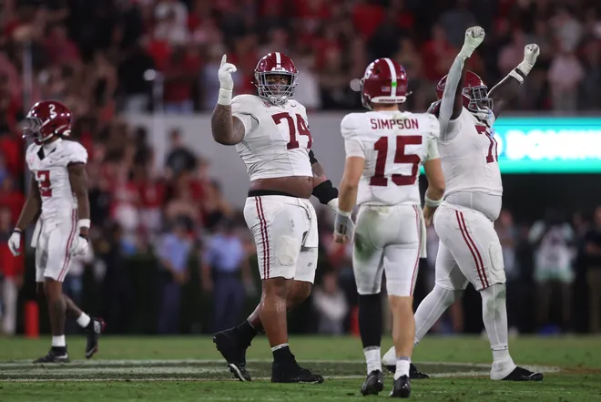 Sep 27, 2025; Athens, Georgia, USA; Alabama Crimson Tide offensive lineman Kadyn Proctor (74) celebrates with quarterback Ty Simpson (15) after defeating the Georgia Bulldogs at Sanford Stadium. Mandatory Credit: Brett Davis-Imagn Images