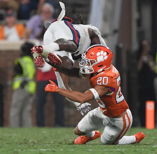 Clemson corner back Avieon Terrell (20) tackles Florida Atlantic runningback Kobe Lewis (5) during the third quarter with Florida Atlantic Sep 16, 2023; Clemson, South Carolina, USA; at Memorial Stadium.