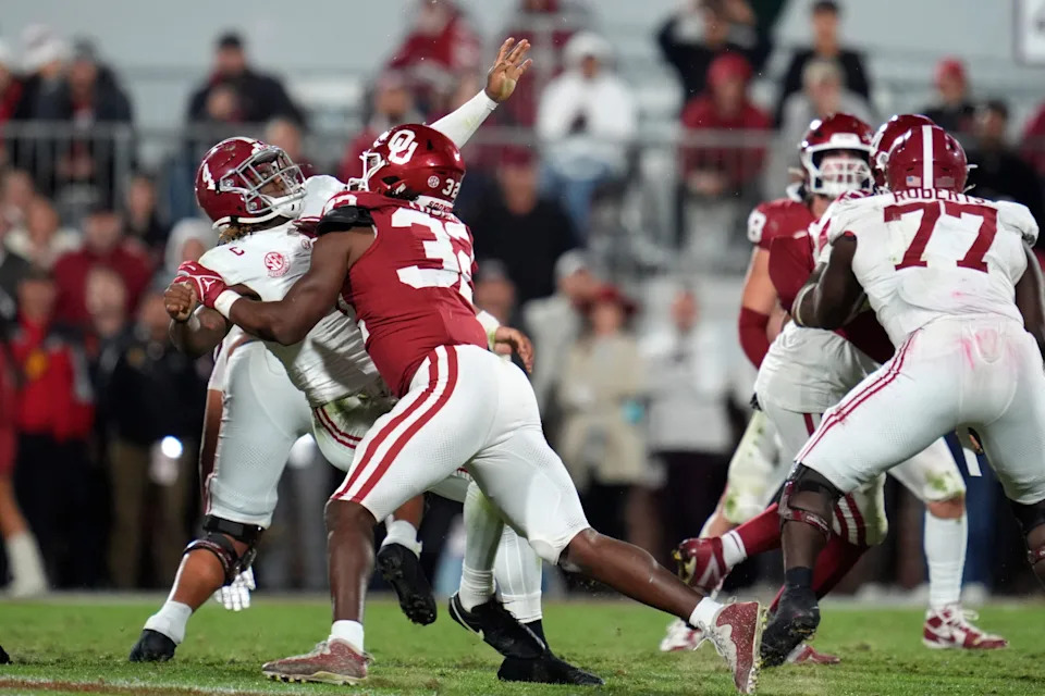 Oklahoma Sooners defensive lineman R Mason Thomas (32) hits Alabama Crimson Tide quarterback Jalen Milroe (4) during a college football game between the University of Oklahoma Sooners (OU) and the Alabama Crimson Tide at Gaylord Family - Oklahoma Memorial Stadium in Norman, Okla., Saturday, Nov. 23, 2024. Oklahoma won 24-3.
