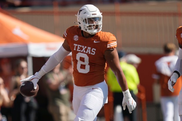 Texas linebacker Trey Moore celebrates a fumble recovery against Florida during the first half of an NCAA football game in Austin, Texas, Saturday, Nov. 9, 2024. (AP Photo/Eric Gay)