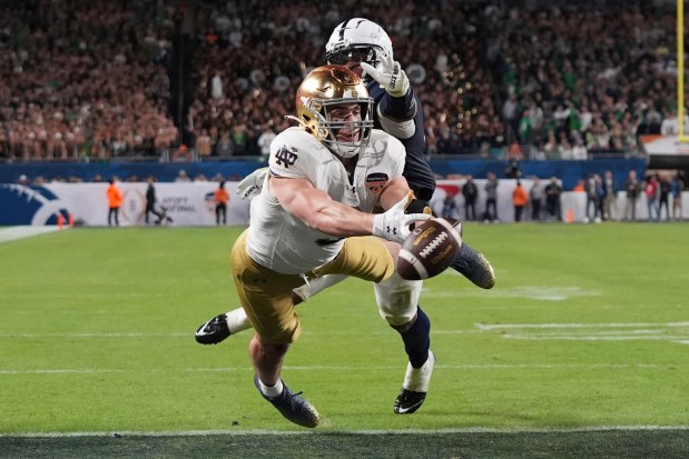 Penn State linebacker Kobe King (41) interferes with a pass intended for Notre Dame tight end Eli Raridon (9) during the second half of the Orange Bowl College Football Playoff semifinal game, Thursday, Jan. 9, 2025, in Miami Gardens, Fla. (AP Photo/Lynne Sladky)