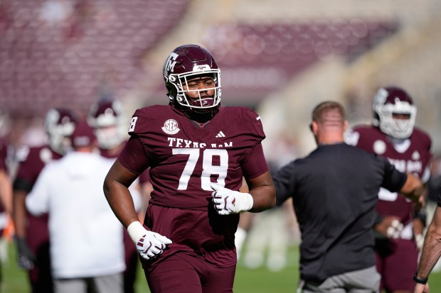 Texas A&M offensive lineman Dametrious Crownover stretches before an NCAA football game against South Carolina Saturday, Nov. 15, 2025, in College Station, Texas. (AP Photo/David J. Phillip)