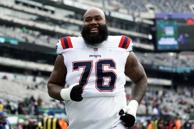 New England Patriots offensive tackle Morgan Moses warms up before an NFL game against the New York Jets on Sunday, Dec. 28, 2025 in East Rutherford, N.J. (AP Photo/Adam Hunger)