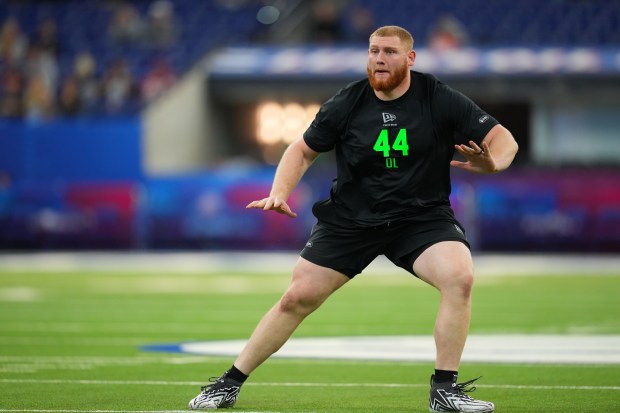 Georgia Tech offensive lineman Keylan Rutledge (44) runs a drill at the NFL football scouting combine in Indianapolis, Sunday, March 1, 2026. (AP Photo/Julio Cortez)