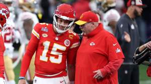 Patrick Mahomes #15 of the Kansas City Chiefs talks with head coach Andy Reid before Super Bowl LVIII against the San Francisco 49ers at Allegiant Stadium on February 11, 2024