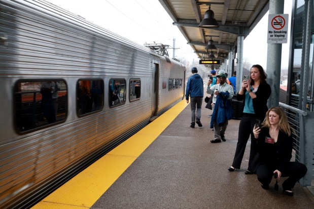 People take photos and videos of the inaugural run of the South Shore Line's new Monon Corridor route, March 31, 2026, at the Hammond Gateway Station in Hammond, Indiana. (Antonio Perez/Chicago Tribune)